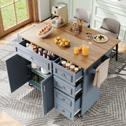 Kitchen island with storage drawers and a wooden top, surrounded by chairs.