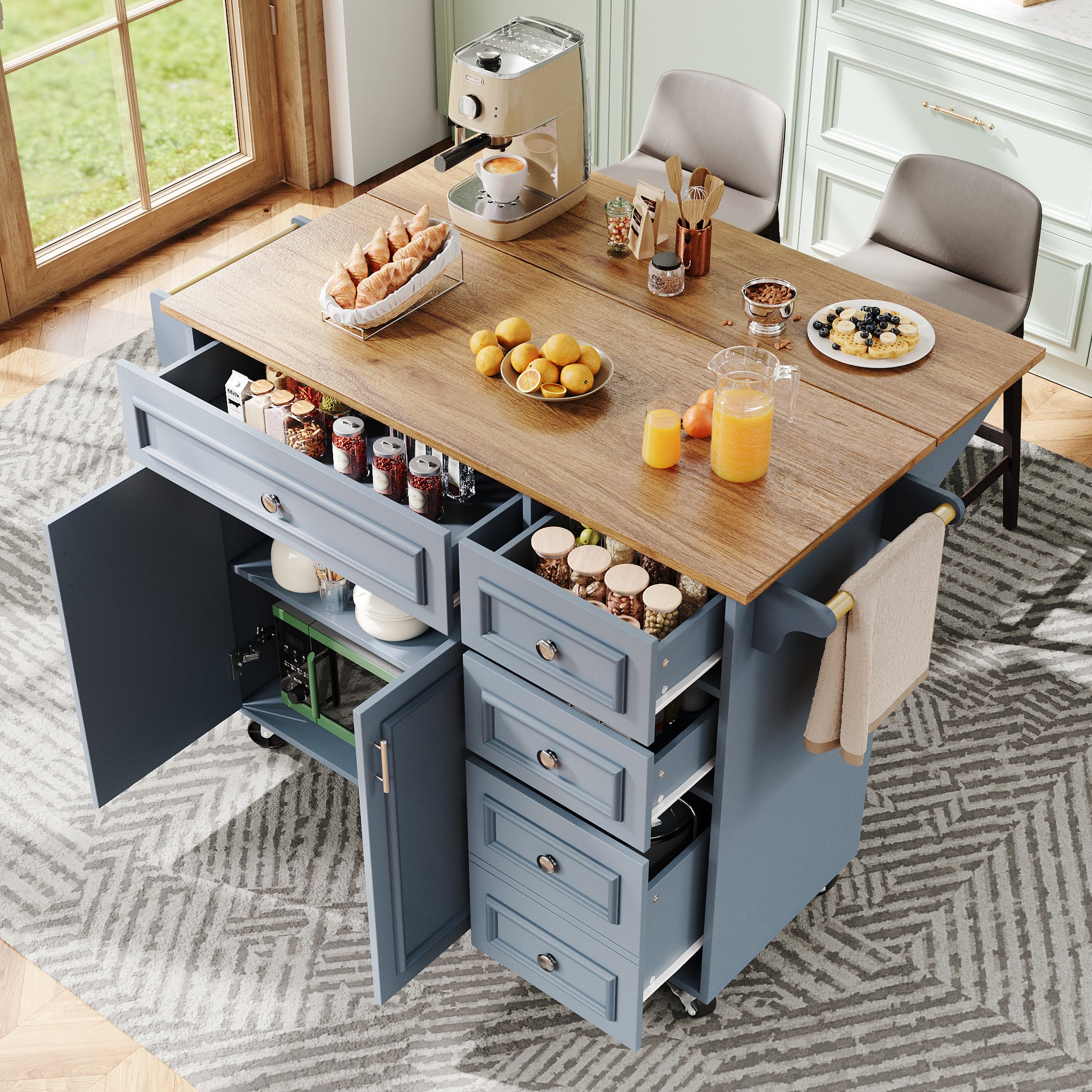 Kitchen island with storage drawers and a wooden top, surrounded by chairs.