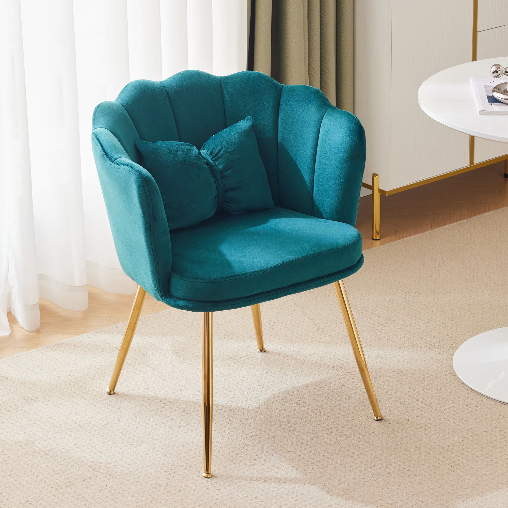 Modern velvet armchair, comfortable upholstered with petal back, gold-plated metal legs and butterfly cushion