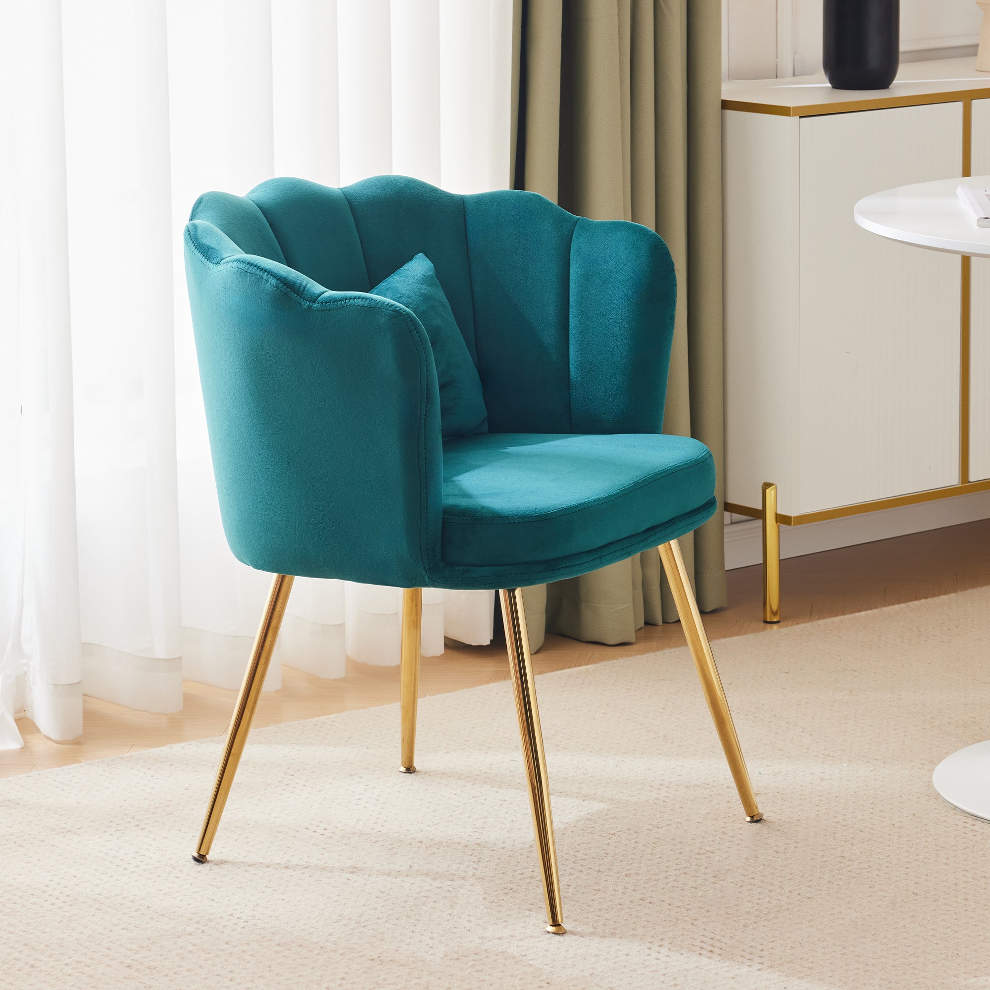 Modern velvet armchair, comfortable upholstered with petal back, gold-plated metal legs and butterfly cushion